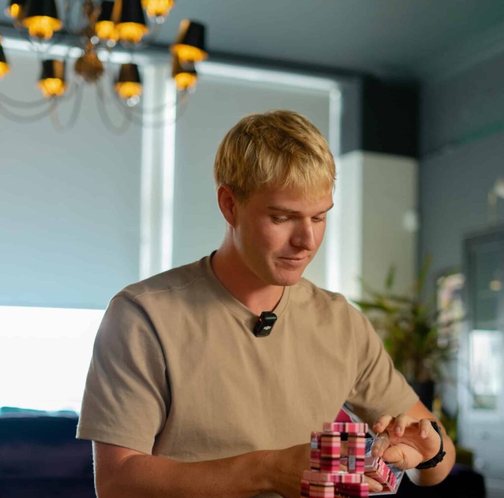 Lewis in the Wellington Wealth Office balancing dominos, Building Wealth for Your Future