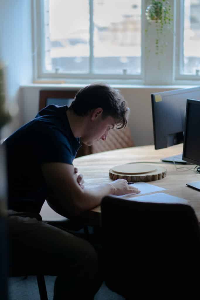 A photo of someone writing down their wishes Why Making a Will Matters - Wellington Wealth