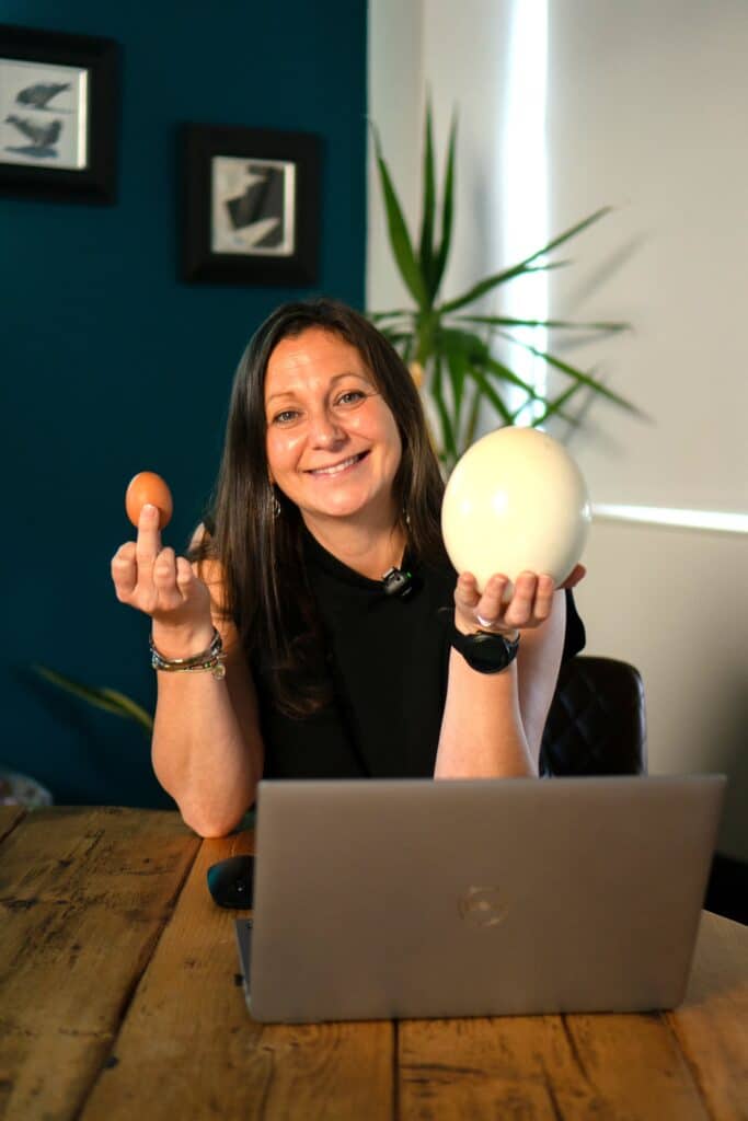 Building Your Nest Egg: An 8-Step Process to Long-Term Financial Security Nicola Ellis Wellington Wealth holding a hens egg and an Ostrich Egg